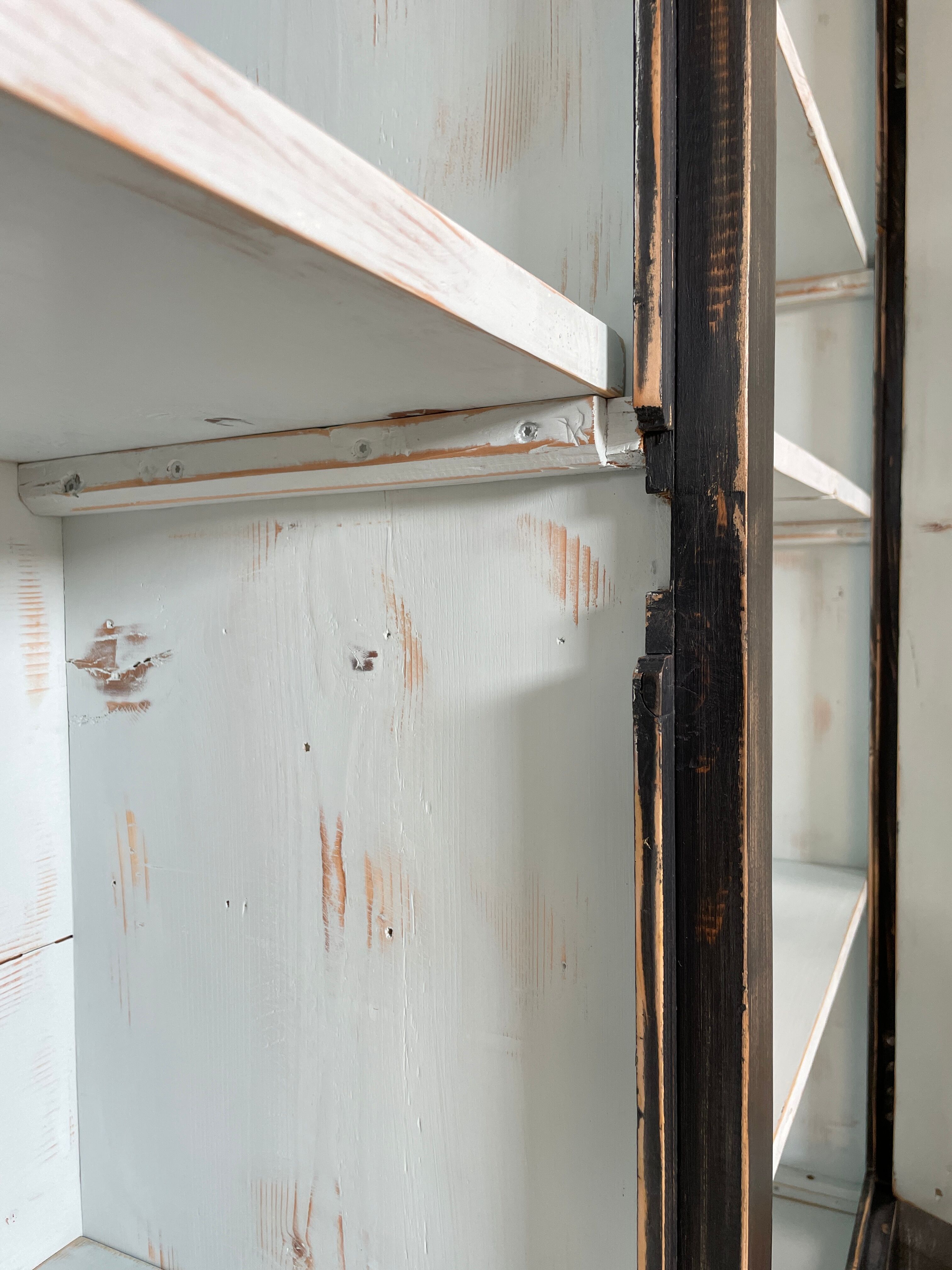 Display cabinet in patinated wood