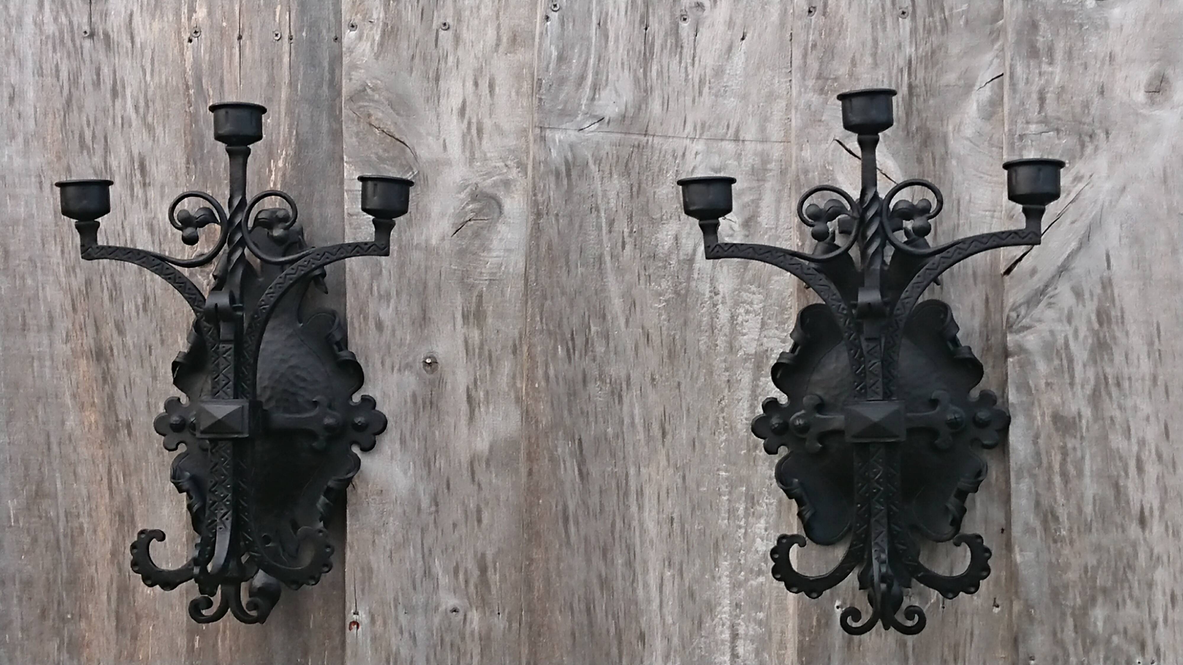 Pair of black wrought iron sconces - neo-Gothic style - from the 1950s