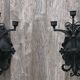 Pair of black wrought iron wall sconces - neo-Gothic style - from the 1950s