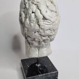 Clay sculpted head on marble base, 32 cm