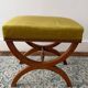 Tabouret curule ancien — noyer, tissu chartreuse, clous laiton