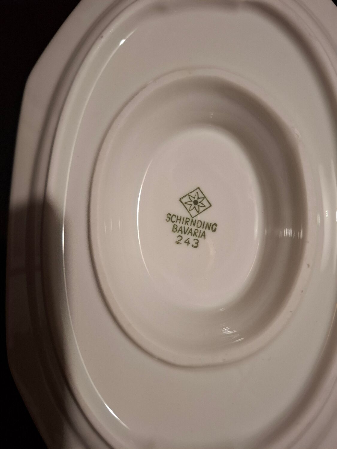 Dishes and porcelain sauceboat