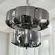 Curved steel chandelier attributed to Max Sauze, 9 lights