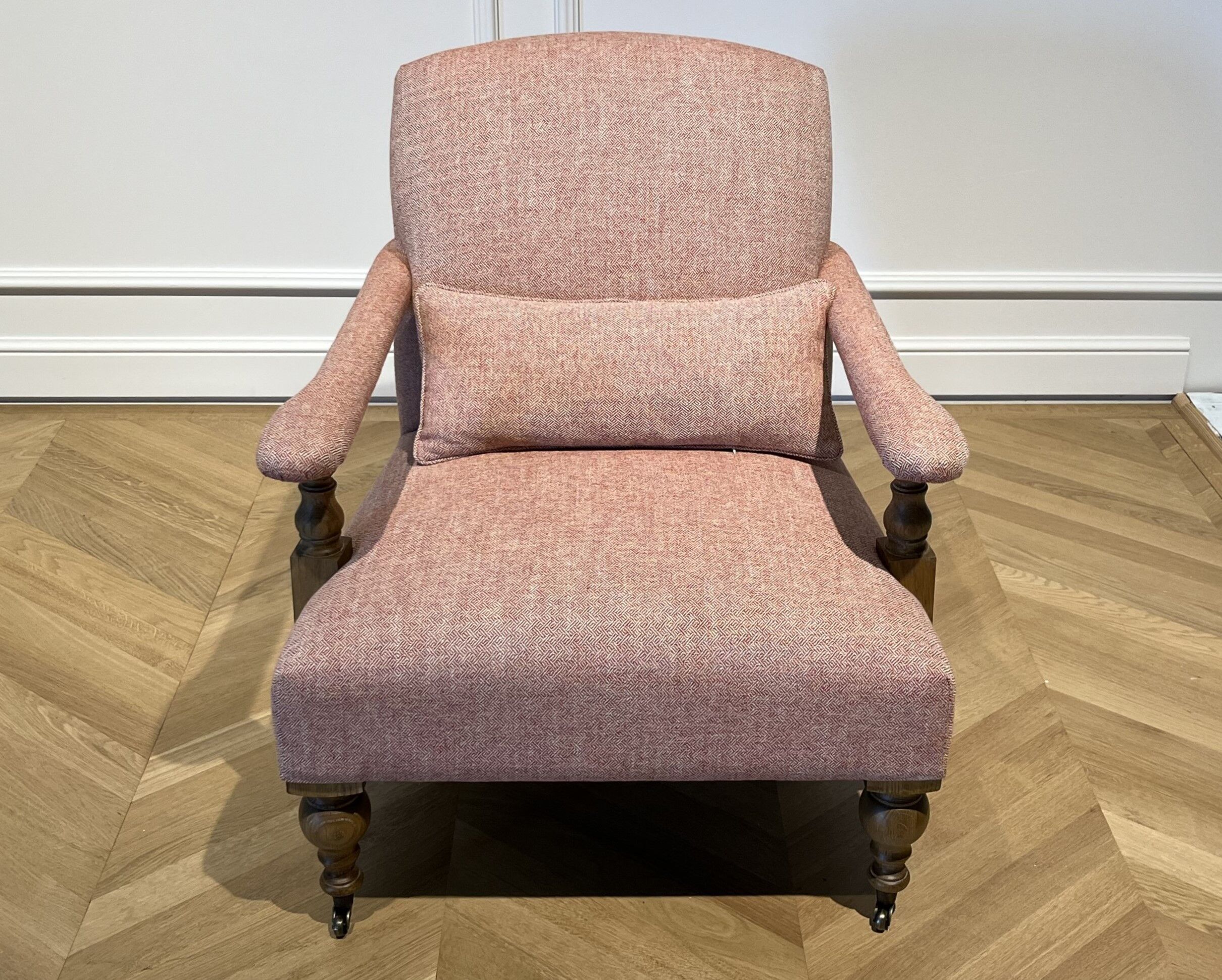 Wooden and red chevron fabric armchair with casters