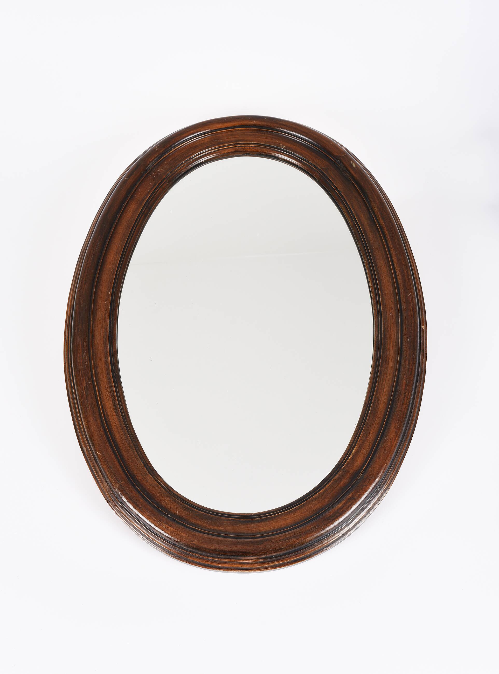 Large old oval wooden mirror