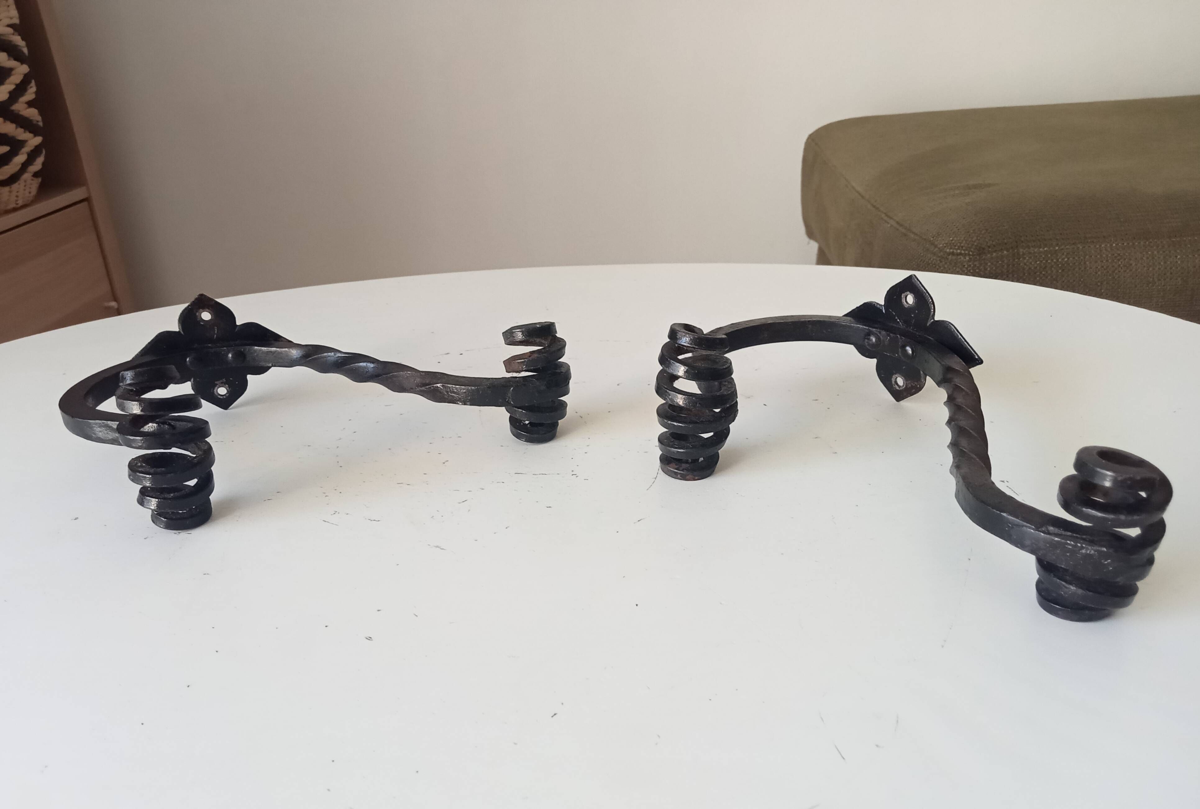 Brutalist wall coat rack in wrought iron.