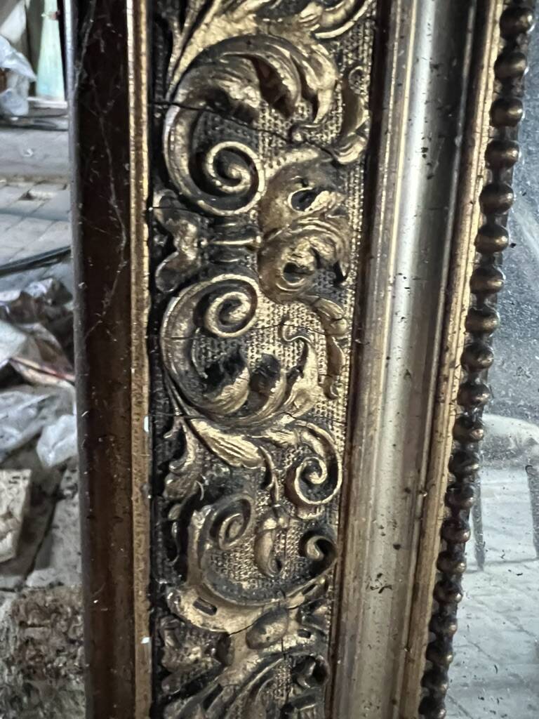 Antique fireplace mirror, gilded stucco frame, 19th century