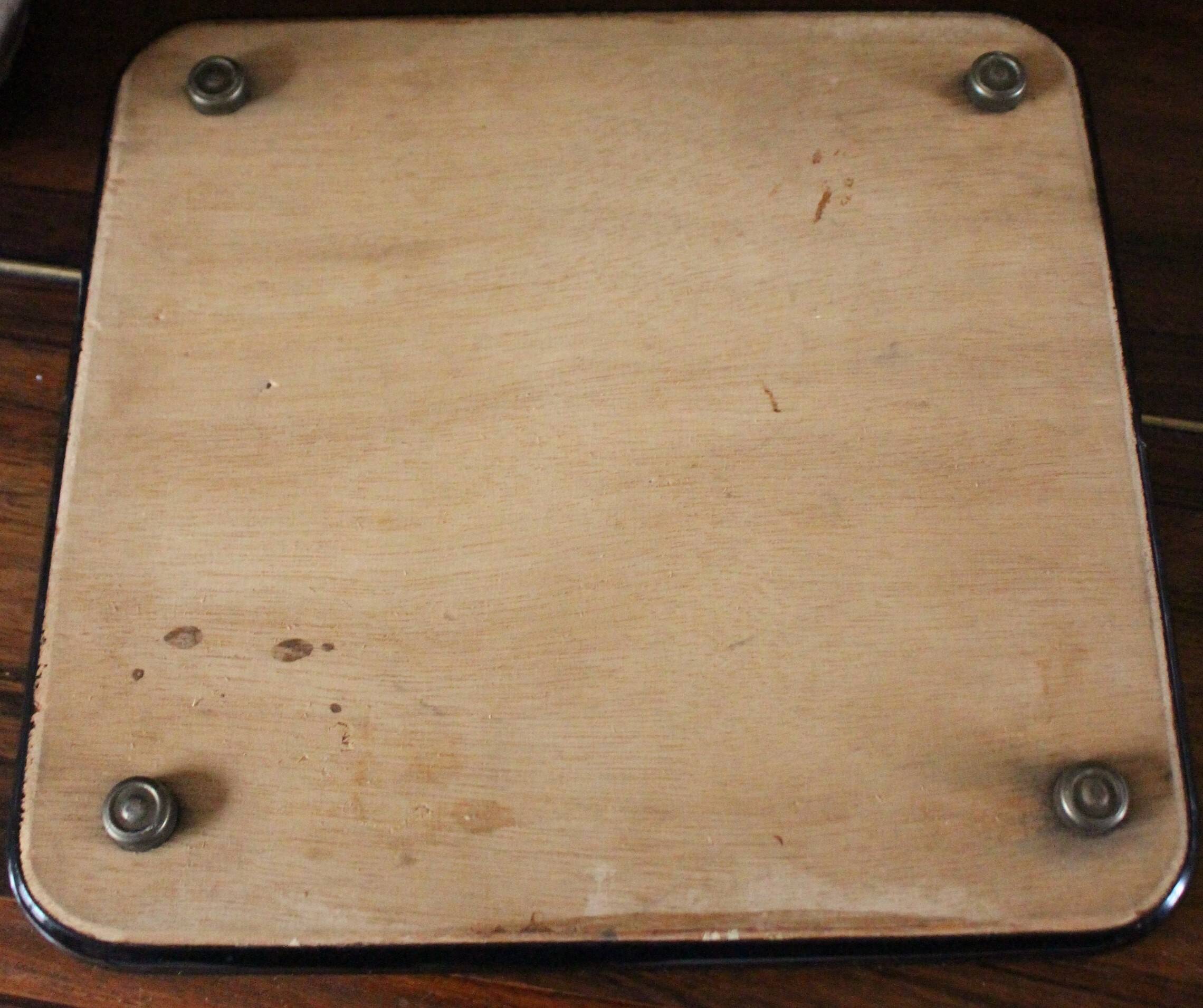 Vintage laminated wooden trivet with yellow, green, and blue flowers