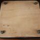 Vintage laminated wooden trivet with yellow, green, and blue flowers