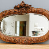 Beveled mirror in carved wood