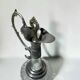 Vintage glass decanter with cut design and silver-plated metal, stopper included.