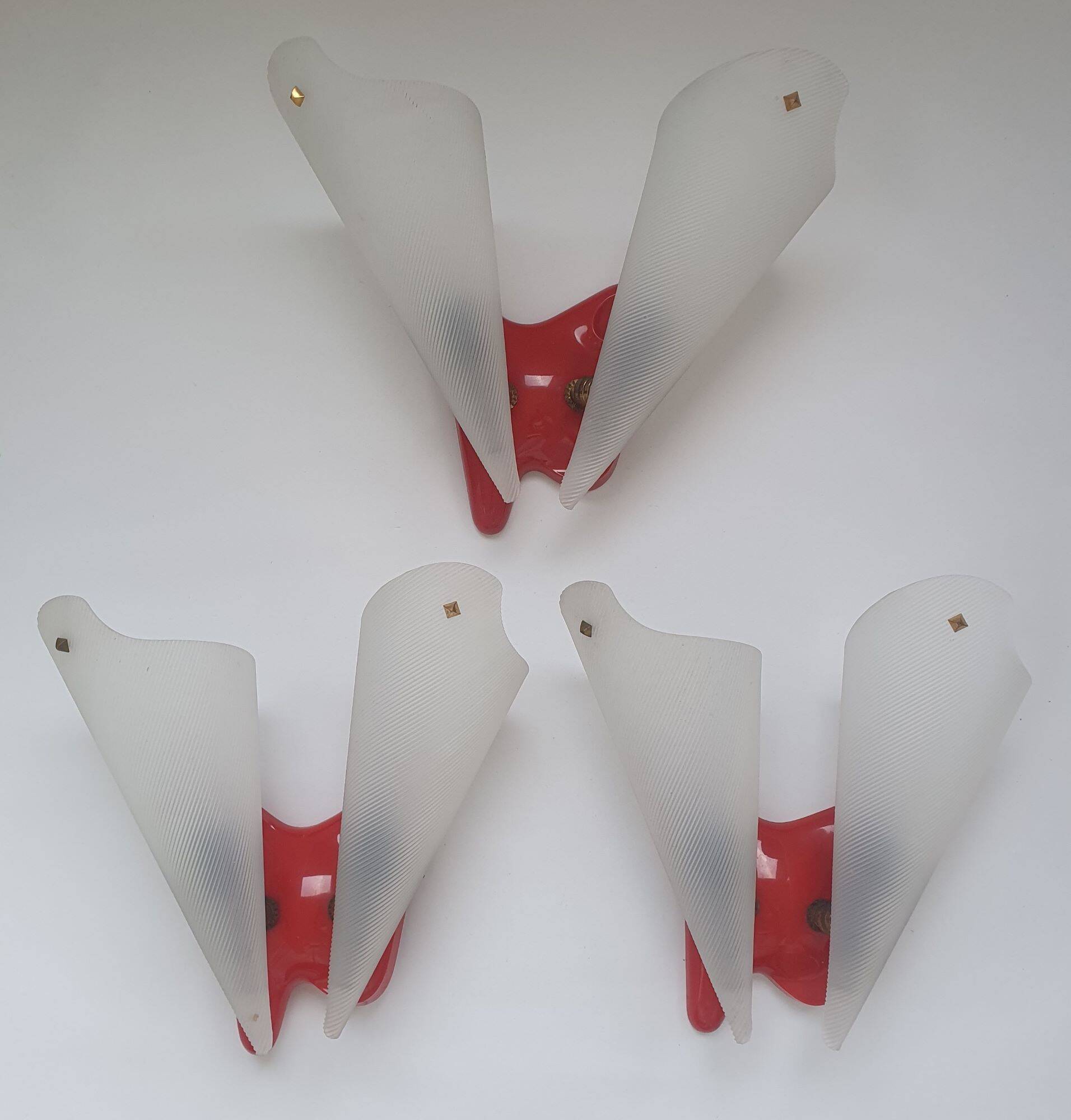 Three vintage rockabilly red plastic wall lights