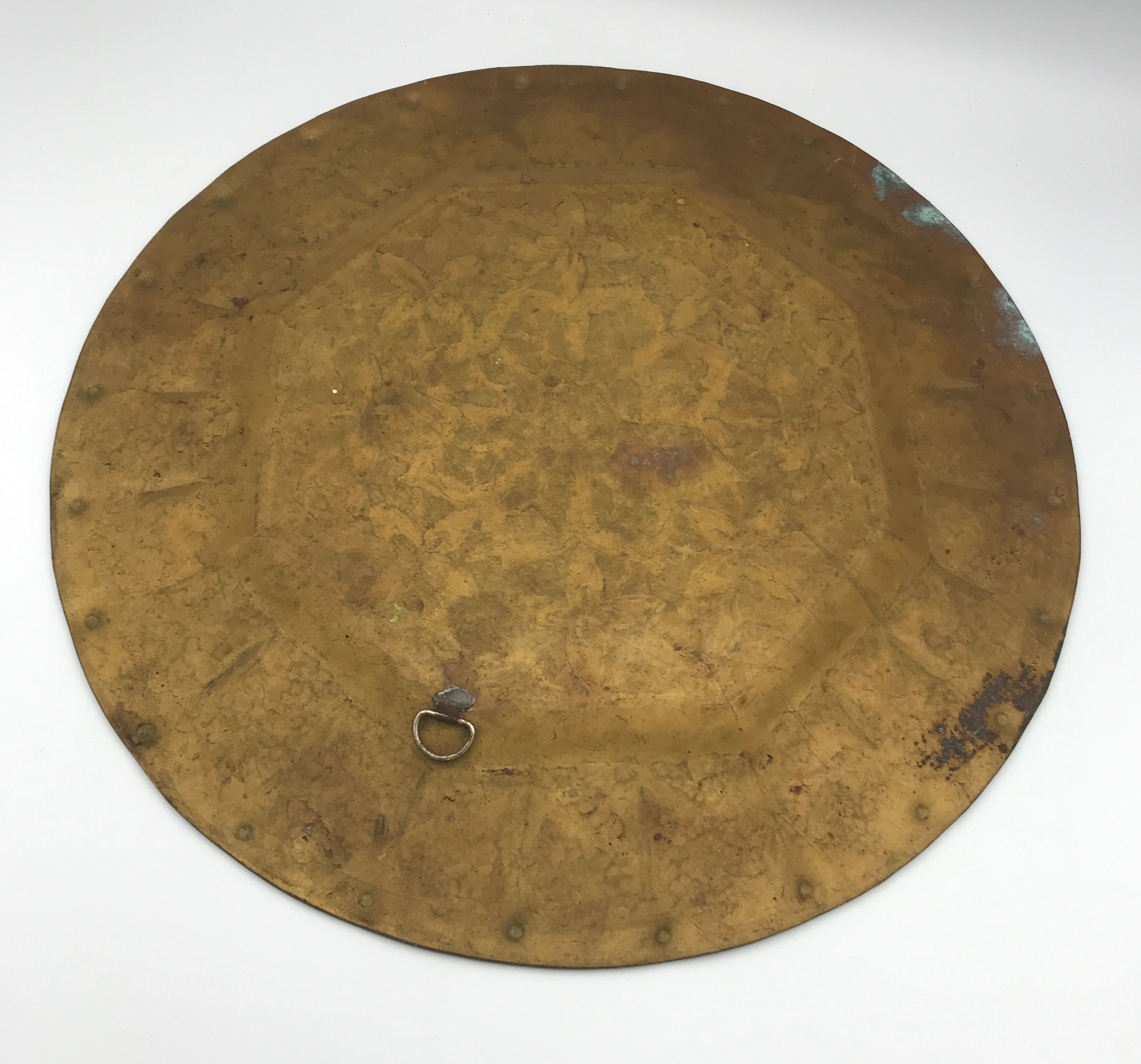 Oriental brass tray with chiseled decoration of arabesques and flowers