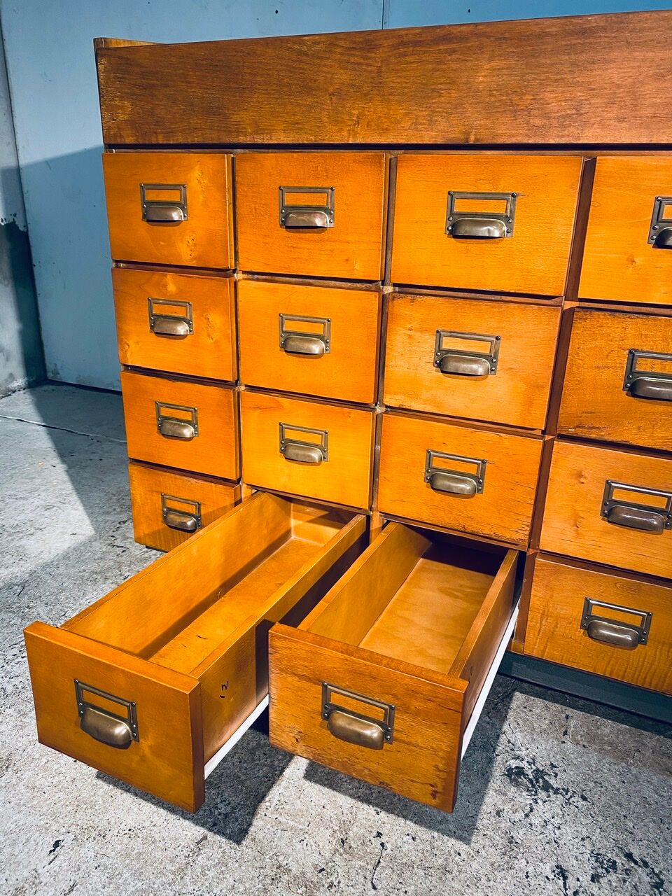 Double-sided wooden industrial filing cabinet with 48 vintage drawers