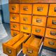 Double-sided wooden industrial filing cabinet with 48 vintage drawers