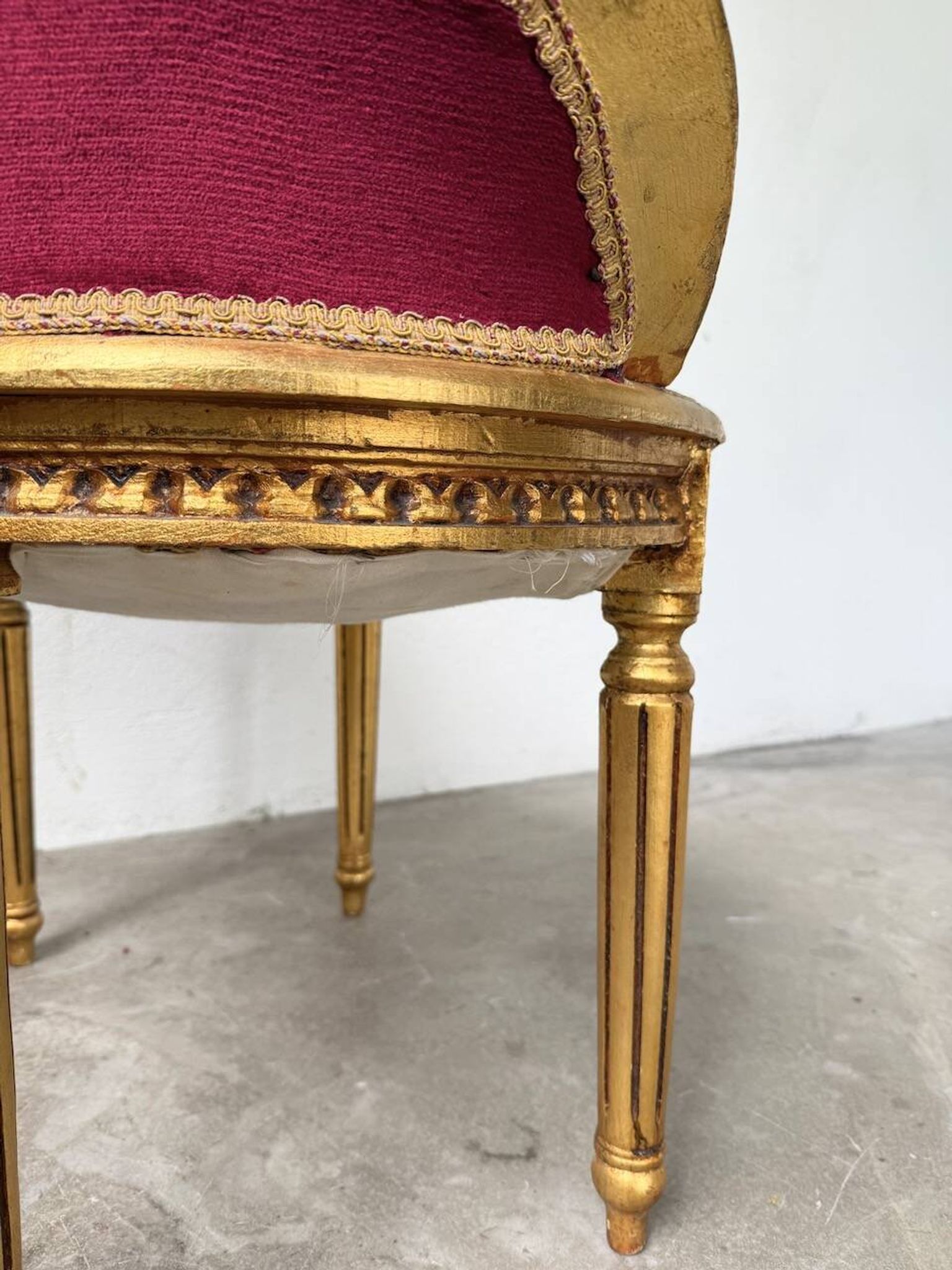 Louis XVI gilt wood and red velvet armchair