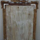 Chic and stylish antique mirror with carved wooden frame in whitewashed