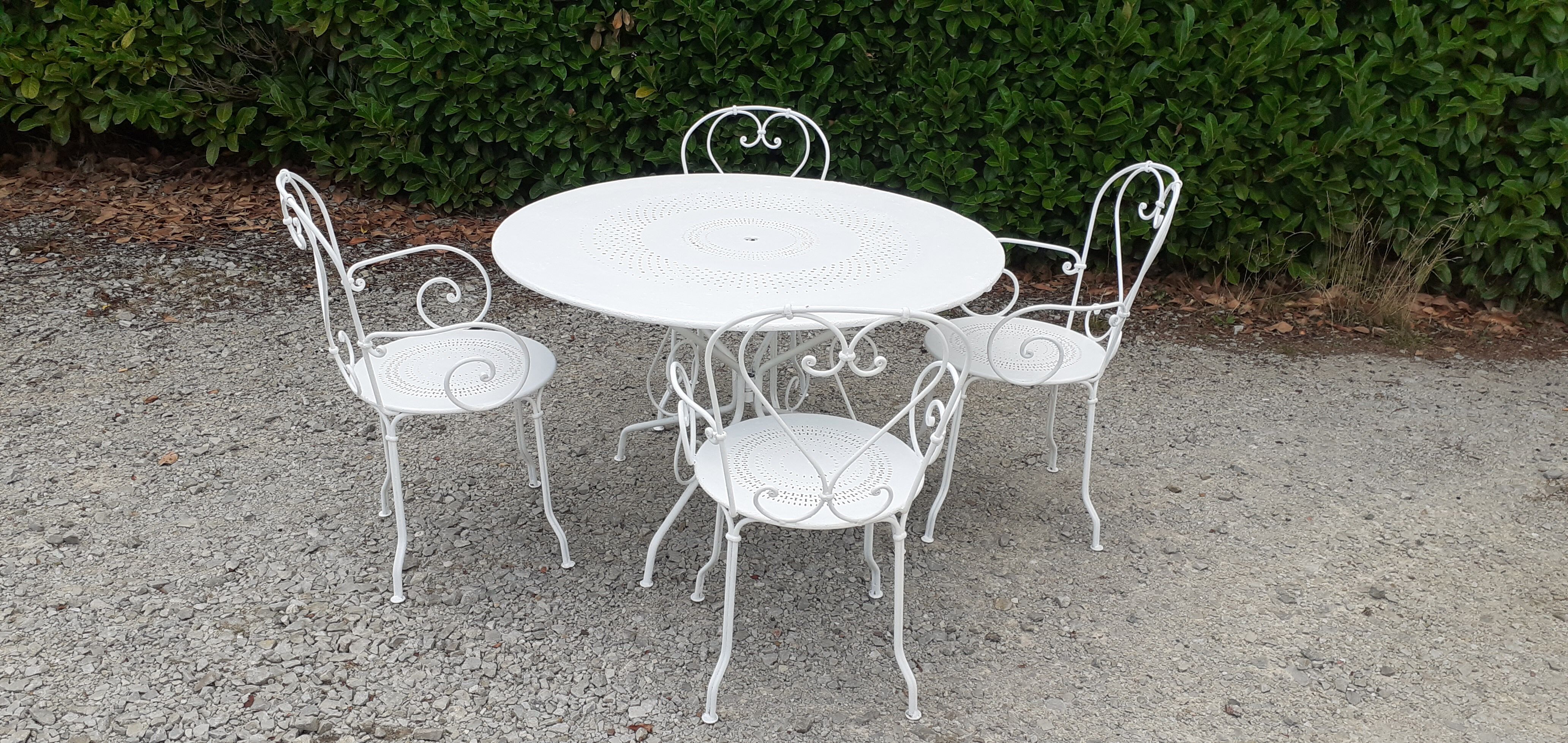 Old white wrought iron garden room