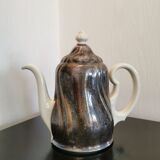 Silver-plated ceramic jug