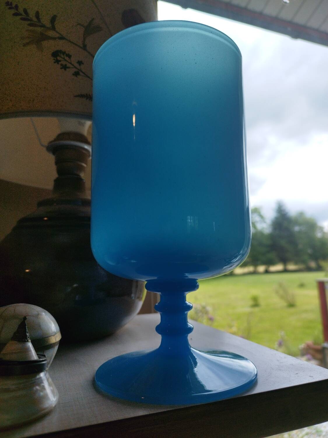 Blue vase on opaline pedestal