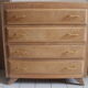 Commode aux pieds compas en bois brut