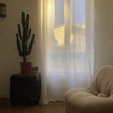 Vintage armchair reupholstered in boucle fabric.