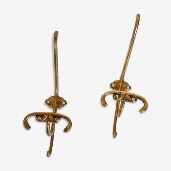 Two old brass patères