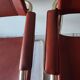 B34 armchairs, cognac leather and gilding