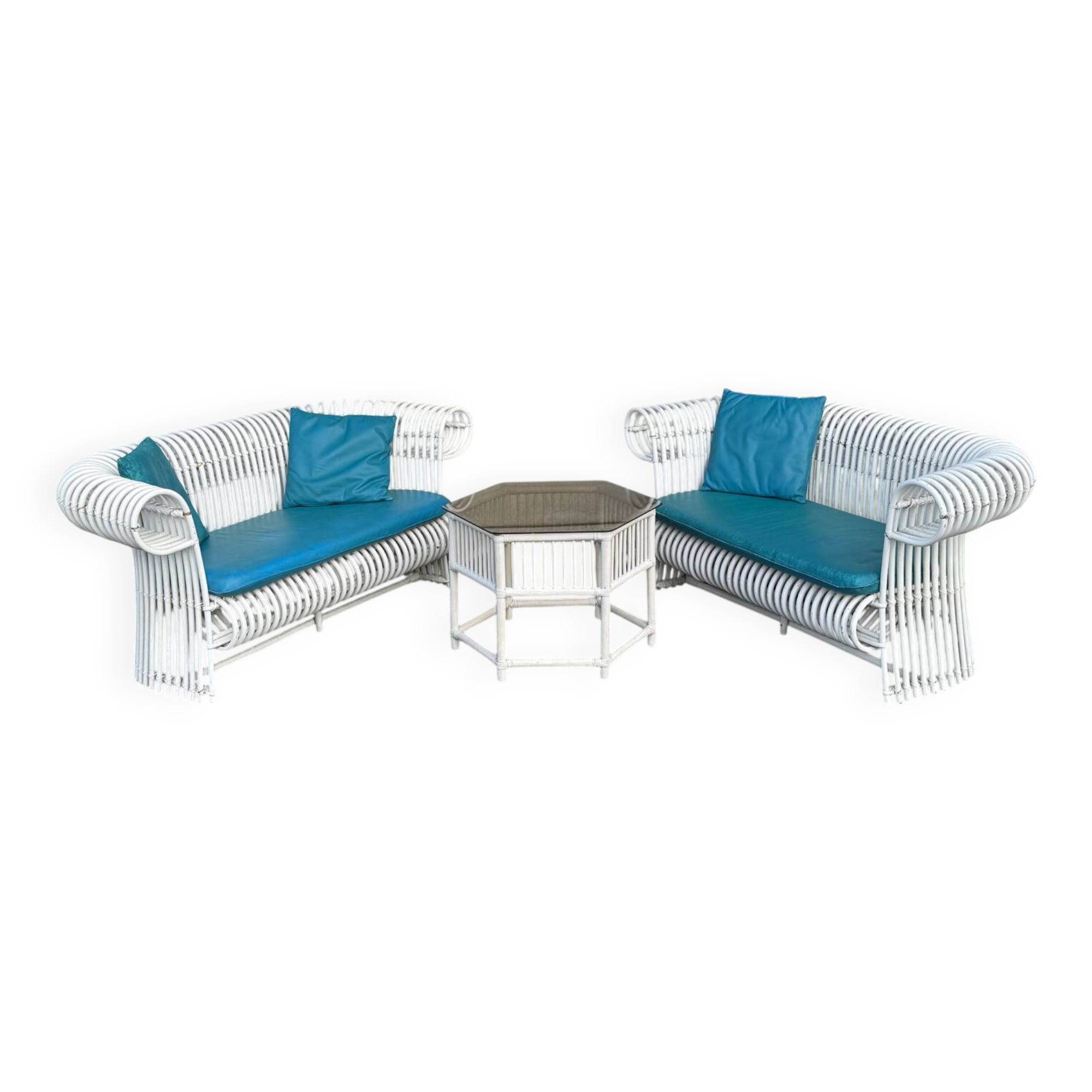 Rattan lounge with two two-seater sofas and a white coffee table.