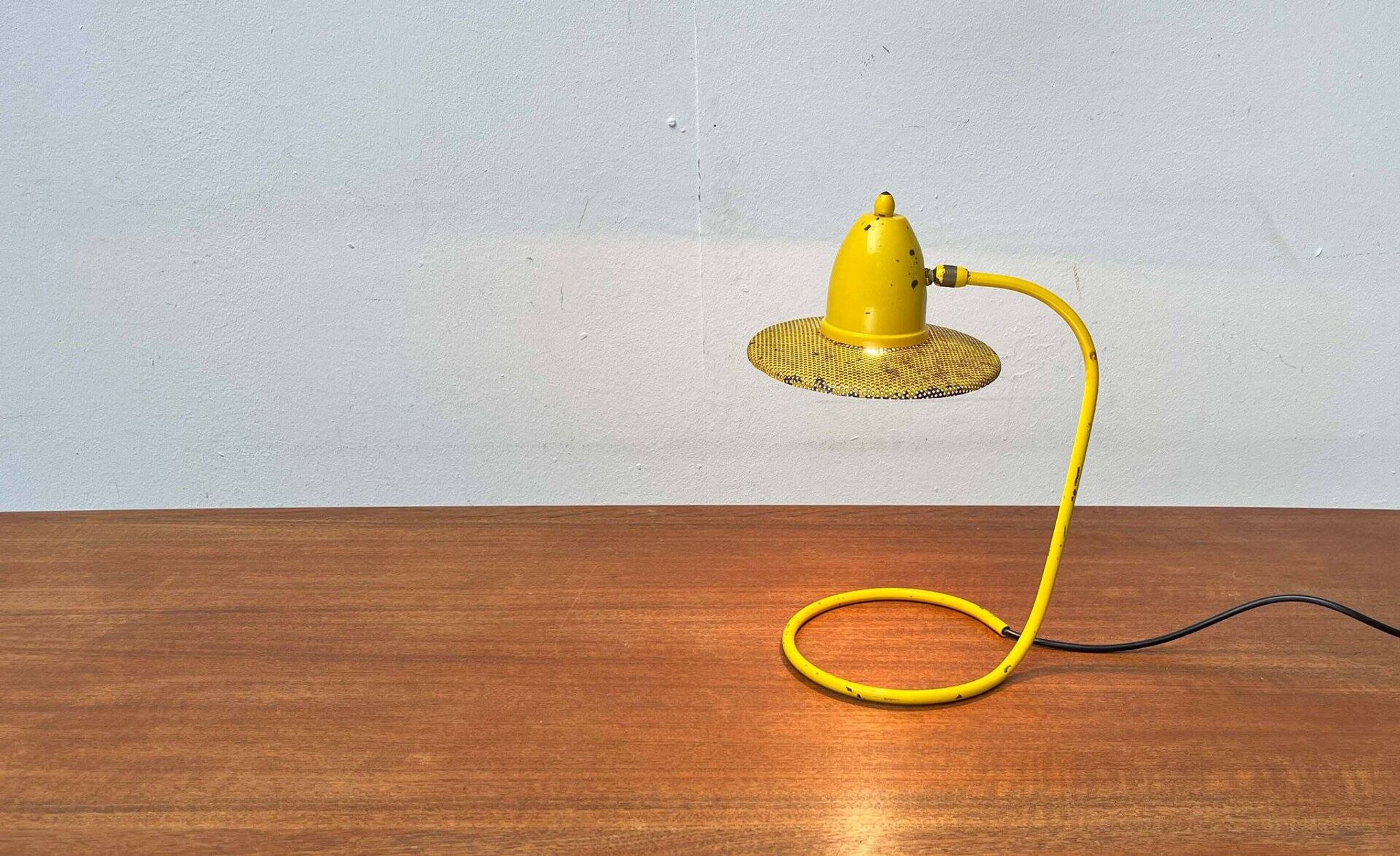 Perforated metal table lamp in Mid-Century Modern style, in the style of Mathieu Matégot, 1960s.