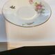 Tasse et sous tasse à décor floral et oiseau