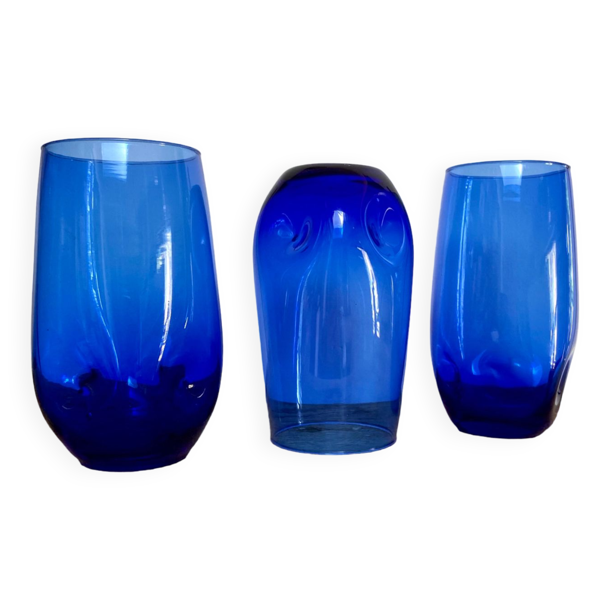 3 blue colored long drink glasses