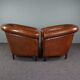 Set of 2 club chairs in black piping sheep leather