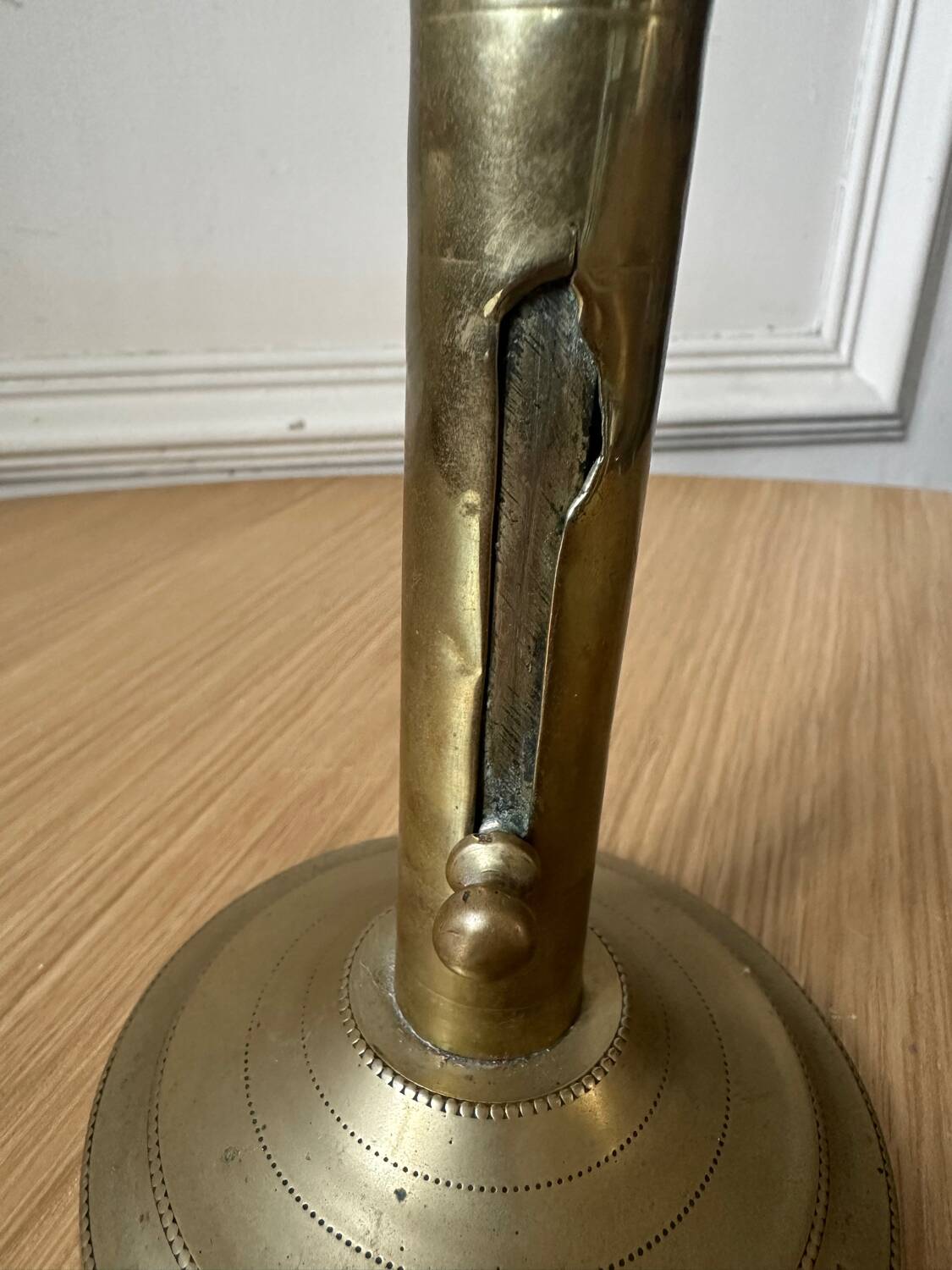 Old brass pull candle holder