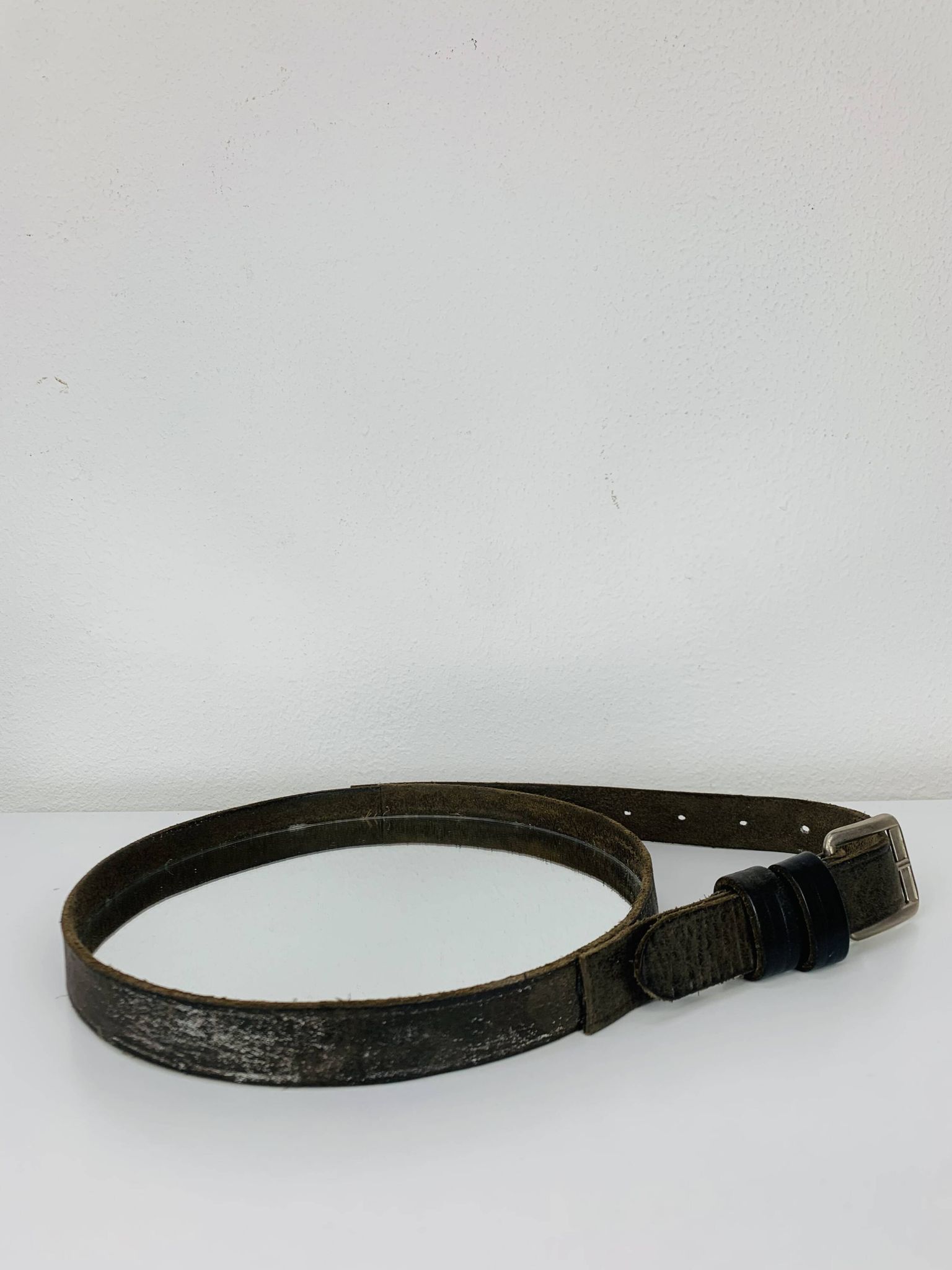 Mirror with handmade leather strapping