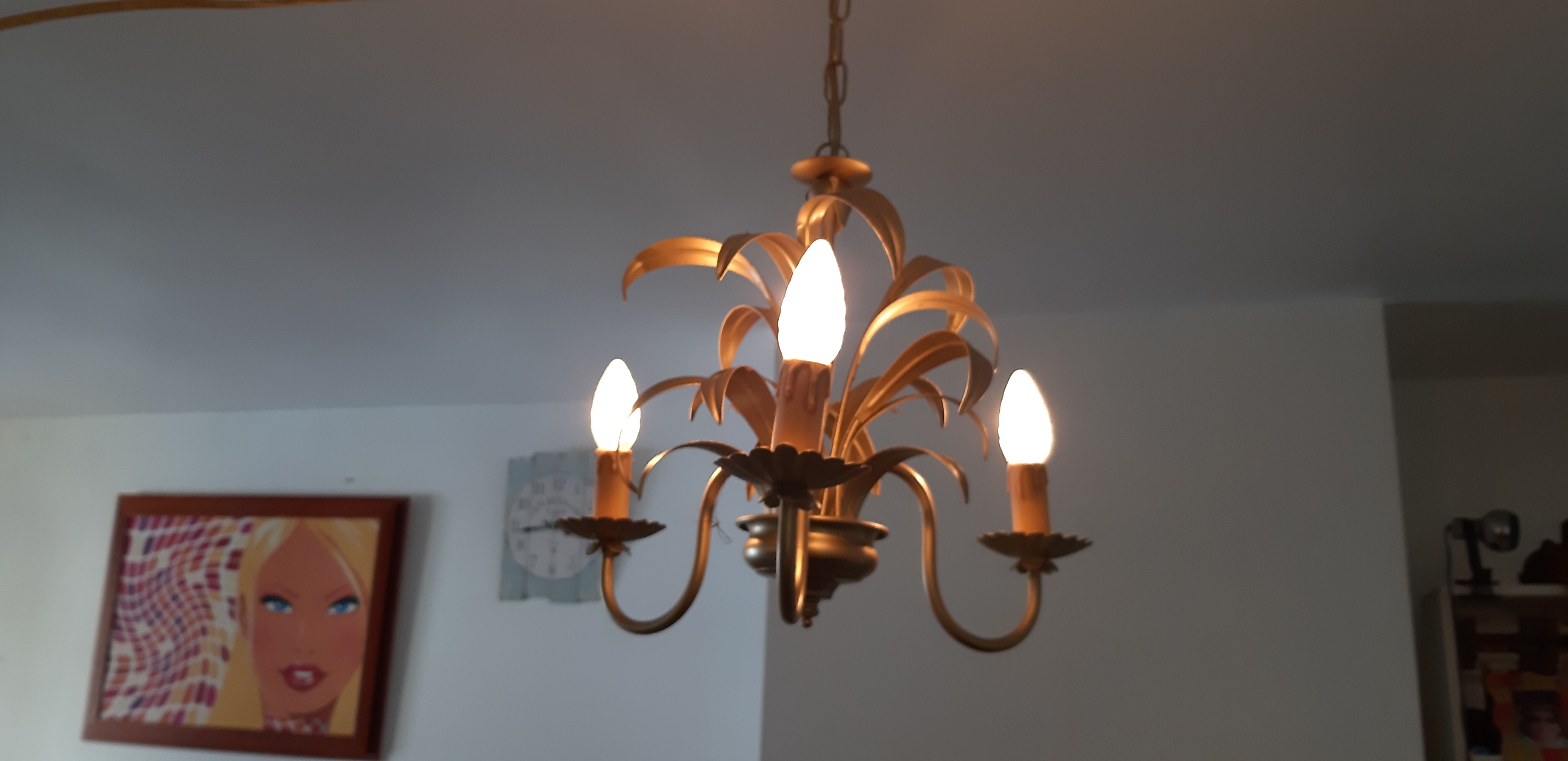 Vintage chandelier in golden metal