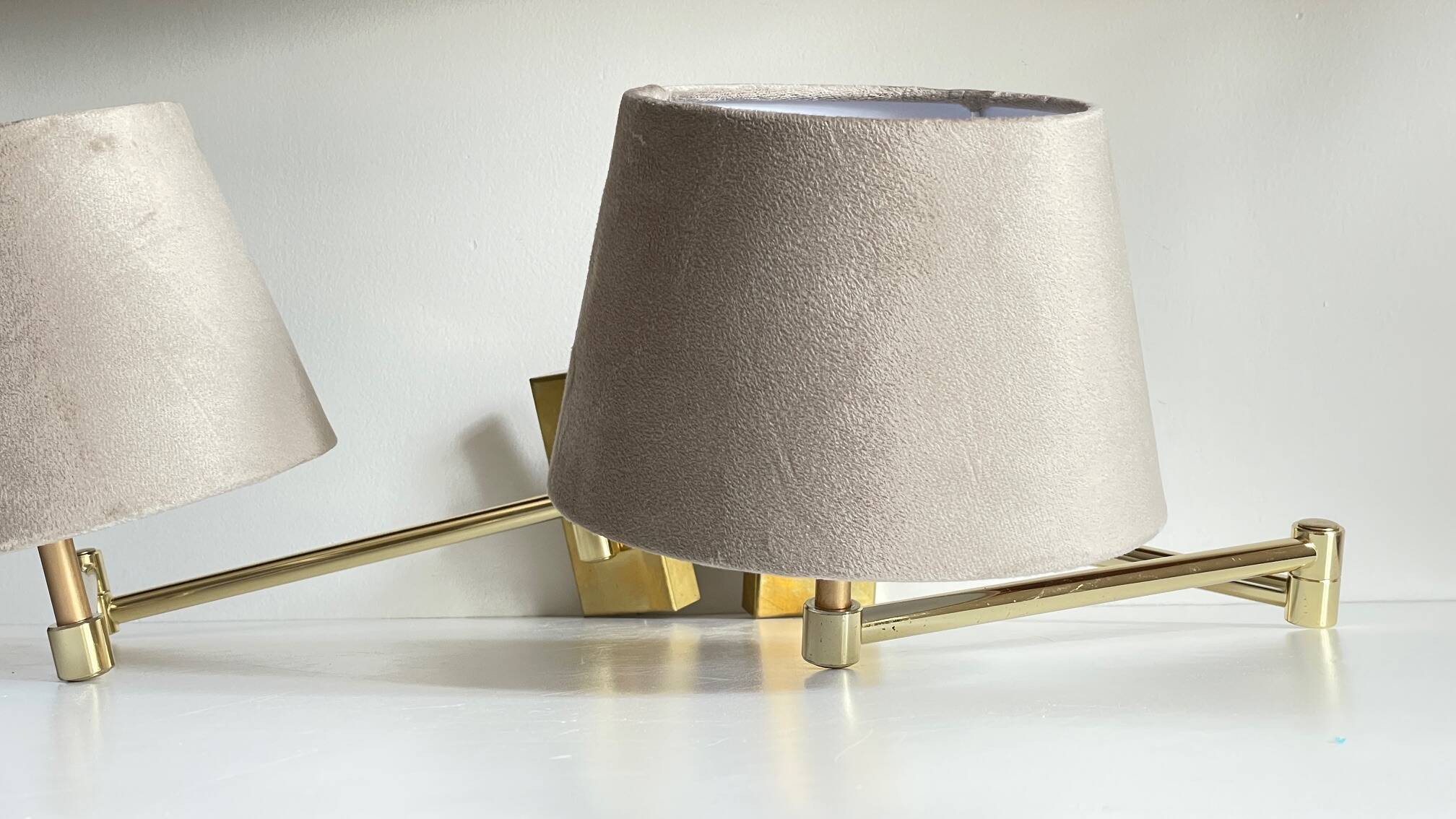 articulated brass and velvet wall light
