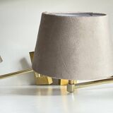 articulated brass and velvet wall light