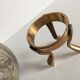 Marble ball paperweight on vintage brass