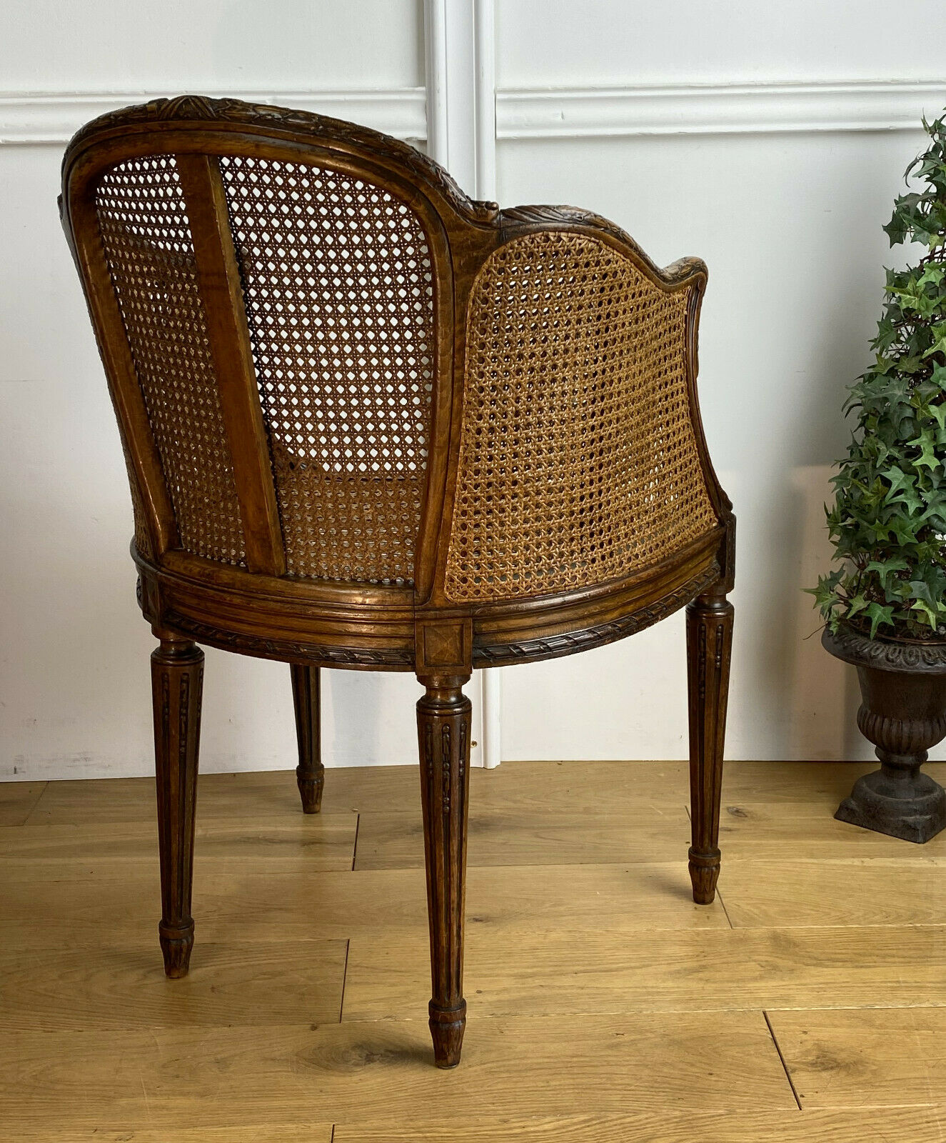 Old armchair with double cannage in walnut carved style Louis XVI of the nineteenth century