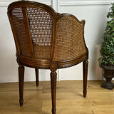 Old armchair with double cannage in walnut carved style Louis XVI of the nineteenth century