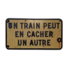 SNCF sign "One train can hide another"