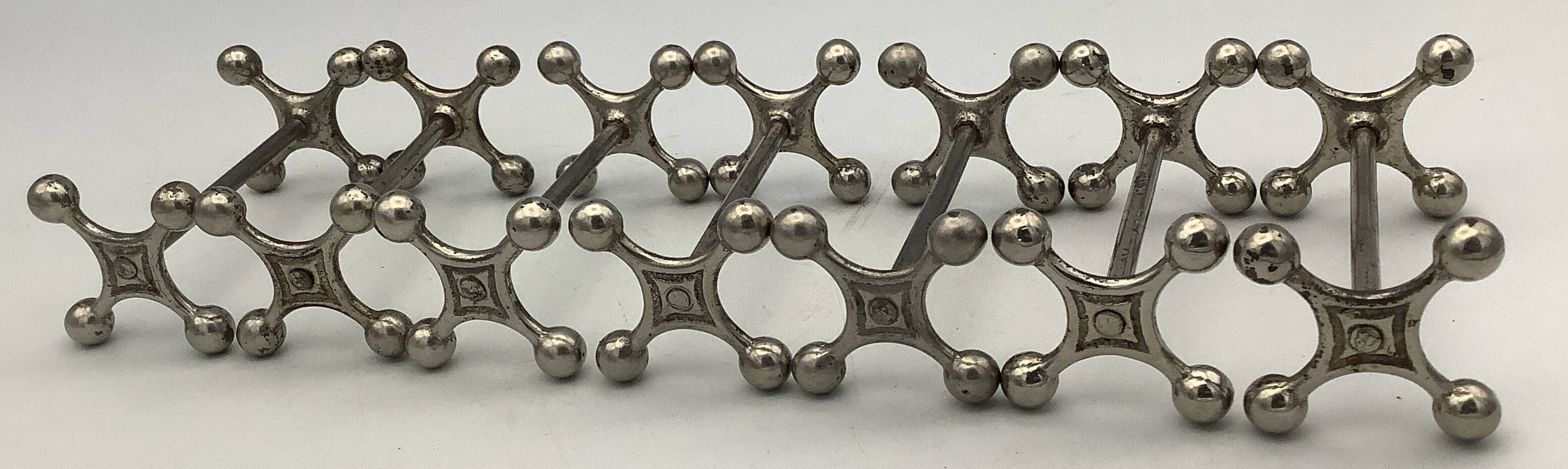 Set of 7 vintage knife rests in the shape of crosses in silver-plated metal.