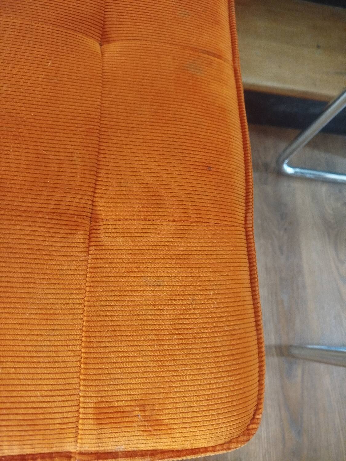 Pair of vintage cantilever chairs in chrome and orange corduroy.