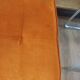 Pair of vintage cantilever chairs in chrome and orange corduroy.