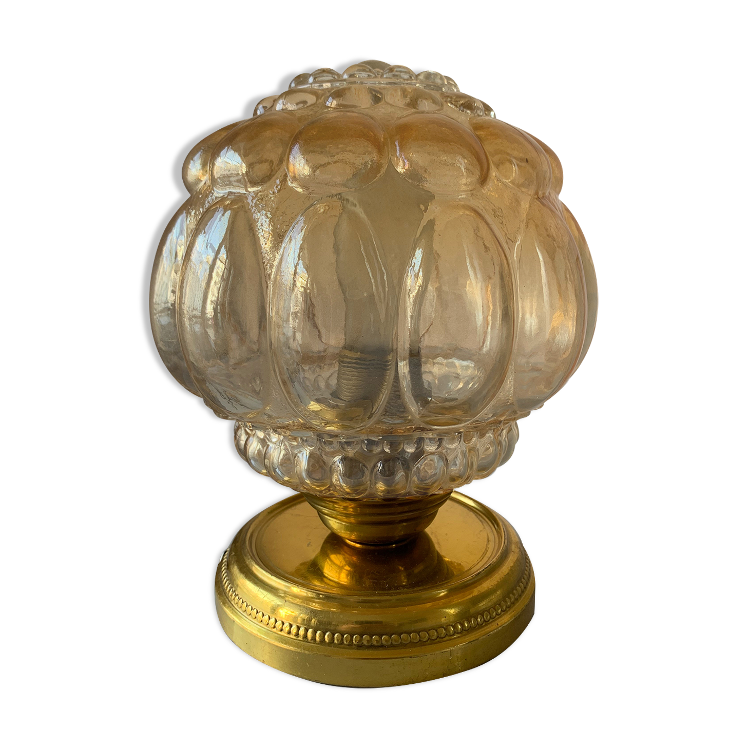 Old vintage table lamp made of amber molded glass