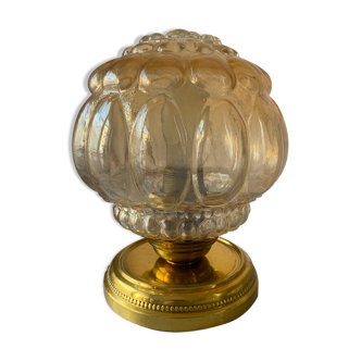 Old vintage table lamp made of amber molded glass