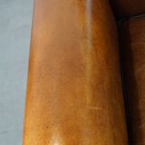 Sheep leather Art Deco design armchair finished with black piping