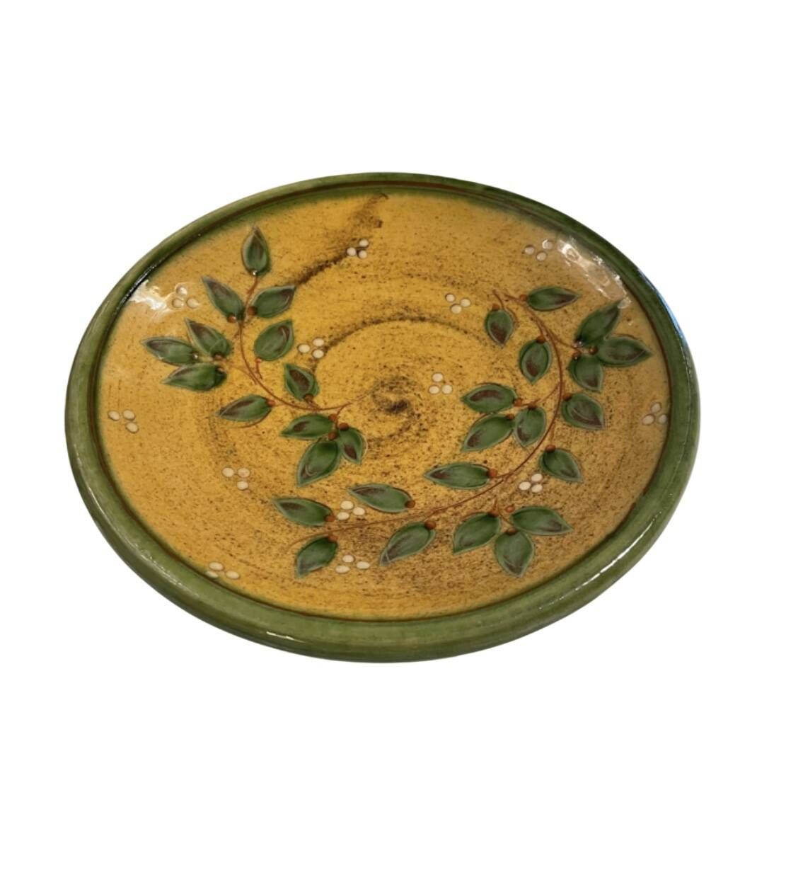 Decorative glazed terracotta plate with olive leaf pattern.