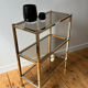 Brass and smoked glass library shelves